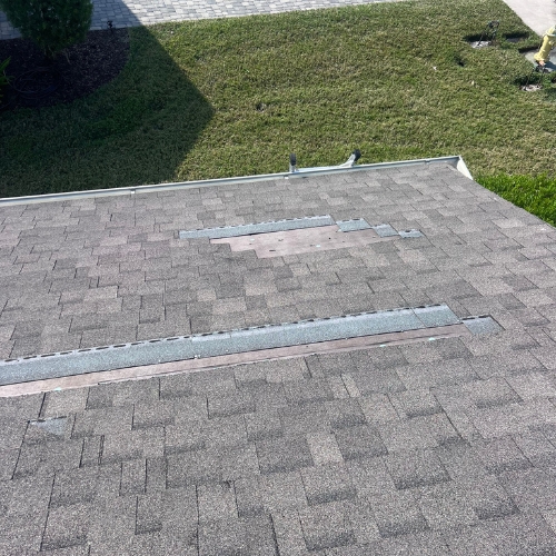 Roof inspection in Bradenton Beach, FL—checking roof health after island squalls.